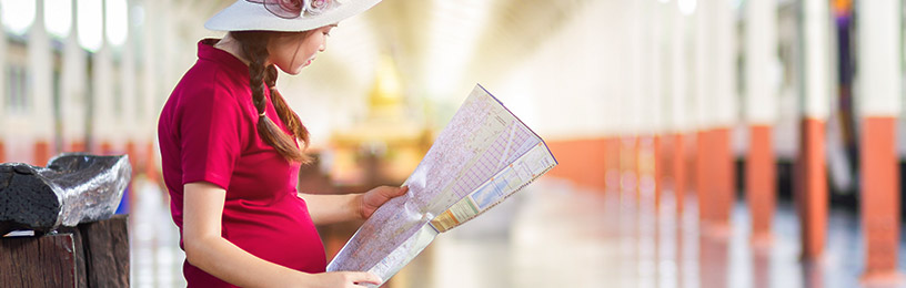 pregnant woman looking at map
